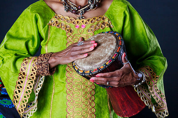 istock African American Woman Playing a Small Drum 522307118