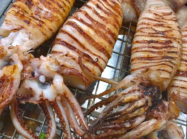 istock The Grilled squid in a market 522307418