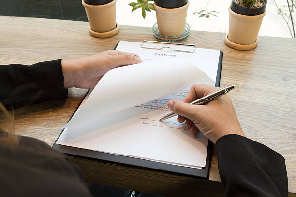 istock Business woman signing contract document form 522308598