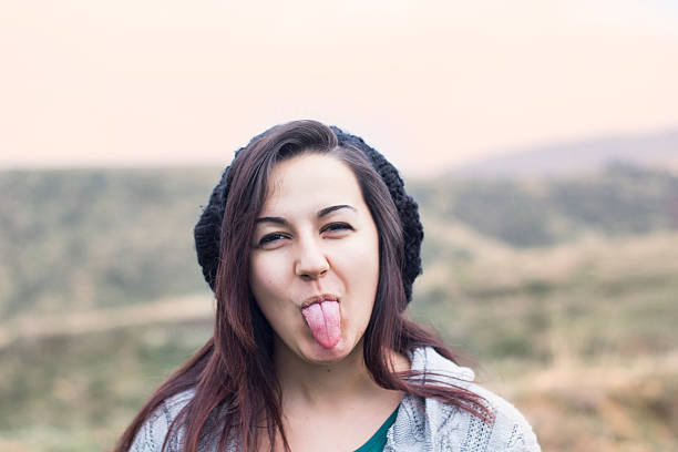 istock Young girl with winter hat and funny face 522310919