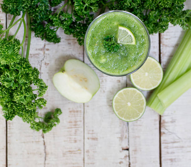 istock Green Detox smoothie with celery stalk, guava, lime, greenery 522311540