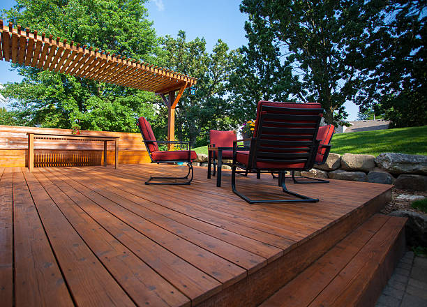 Backyard Deck Backyard deck with deck chairs and a pergola on a sunny summer day. garden feature stock pictures, royalty-free photos & images