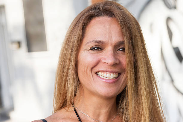 istock Mature hispanic woman smiling 522312301
