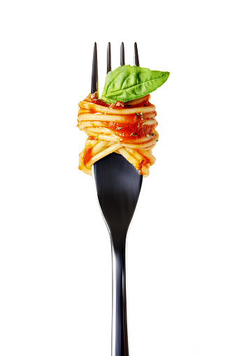 silver fork with pasta, tomatoes sauce and basil leafe isolated on white background