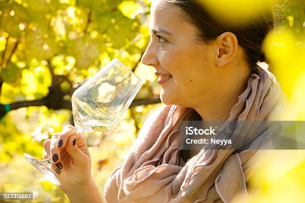 Female Winemaker With Glass Of White Wine In Vineyard Stock Photo - Download Image Now