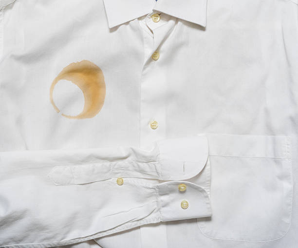 coffee stain on a shirt stock photo
