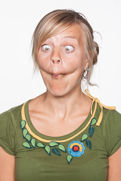 Young woman making a sour face Young woman making a sour face sour face stock pictures, royalty-free photos & images