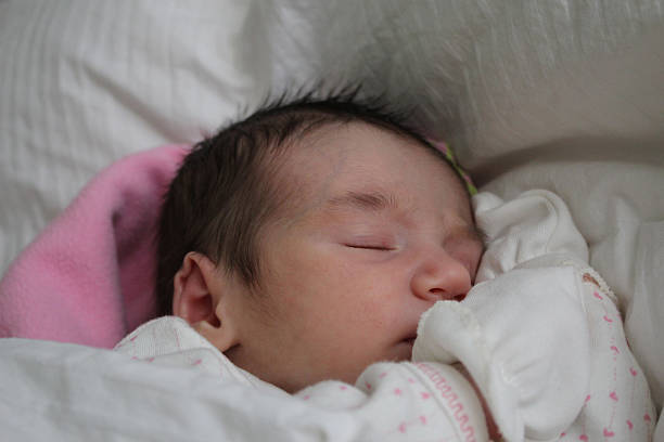 istock sleeping newborn baby girl 522313855