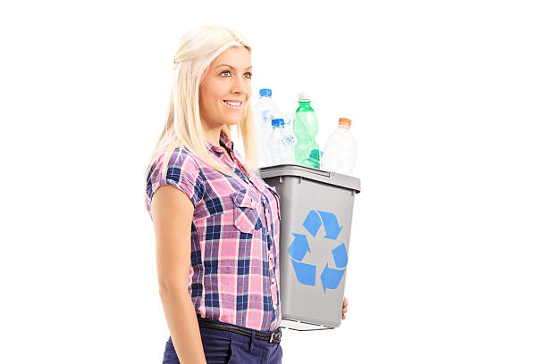 istock Woman carrying a recycle bin 522315293