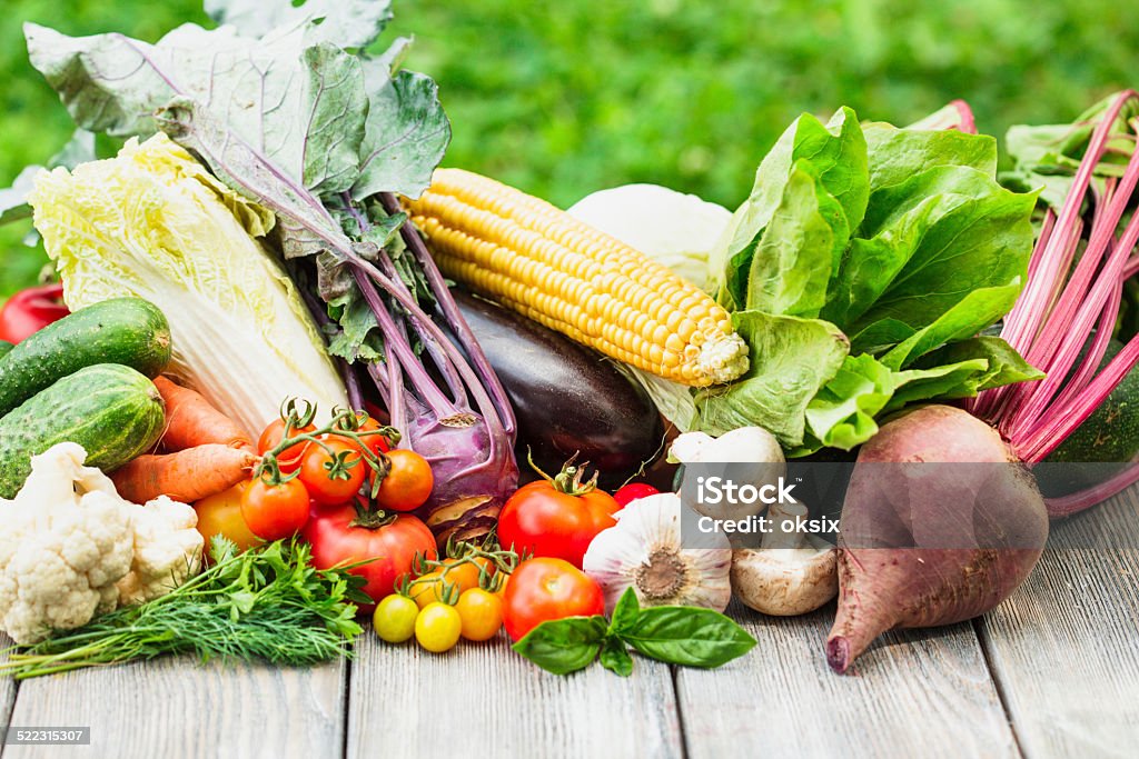 Vegetables on wooden table Various vegetables on a wooden table with copy space Agriculture Stock Photo