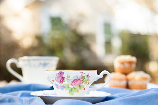 istock Tea, muffins with house background.  Breakfast. Relaxation. 522316352
