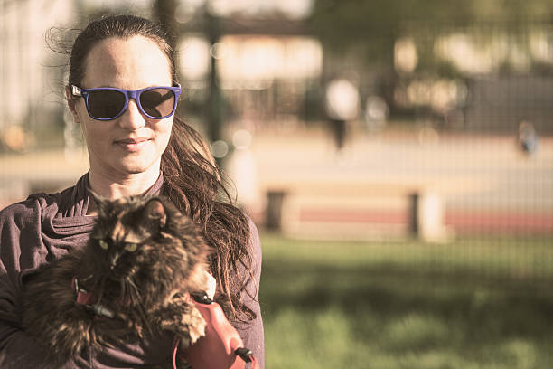 istock Woman with cat outside smiling 522317618
