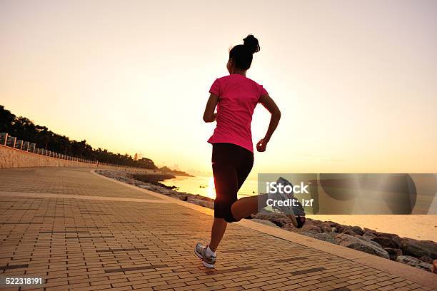 Healthy Lifestyle Asian Woman Running At Sunrise Seaside Stock Photo - Download Image Now