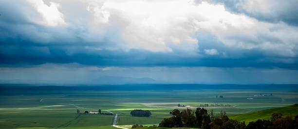 istock Valley landscape in a stormy day with large rain clouds 522318726