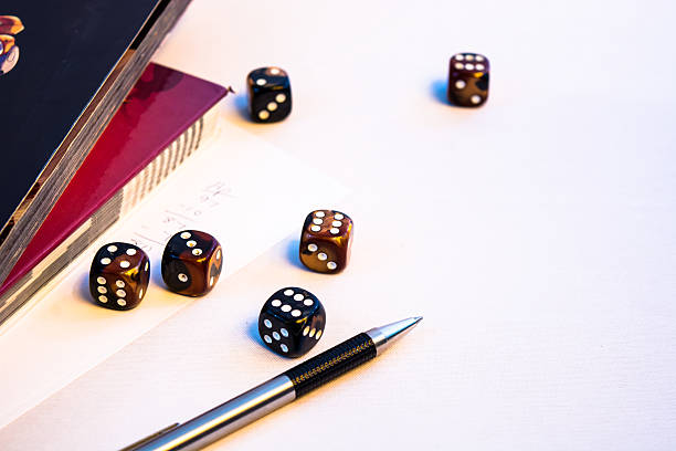 istock Set of Roleplaying dice on a book 522319722