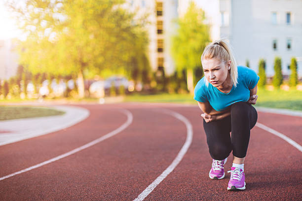 istock female jogger in a pain 522321676