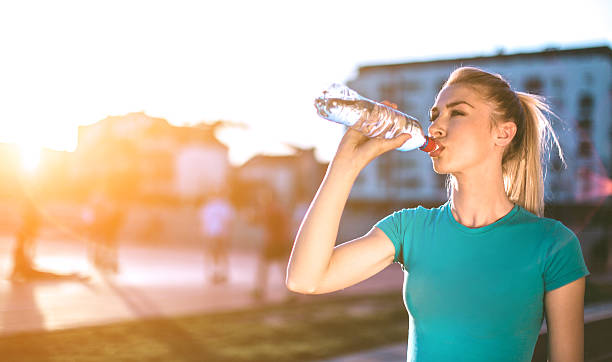 istock woman drinking water 522323026