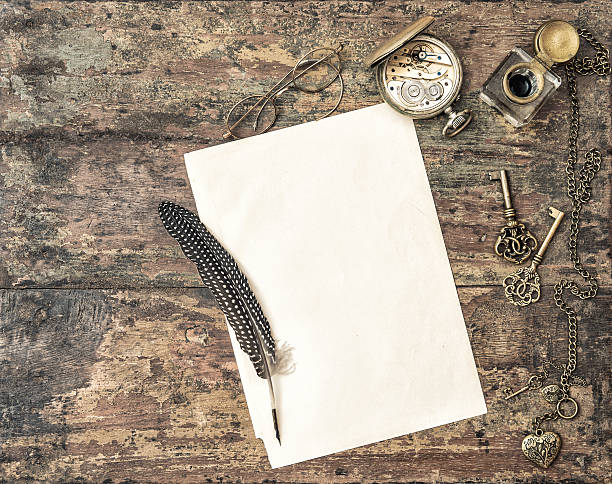 istock Open book and antique writing accessories vintage 522328094