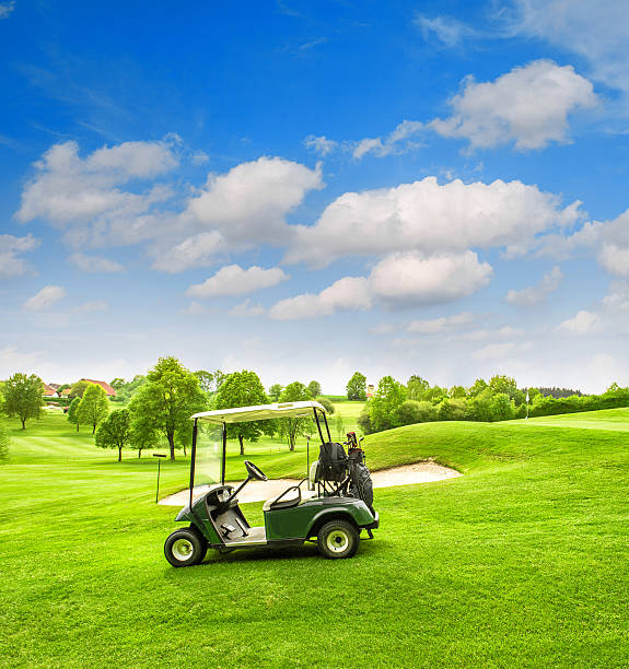 A lone man steers a golf cart through a vibrant green fairway under a cloudy sky, reflecting a serene blend of leisure, nature, and quiet contemplation.