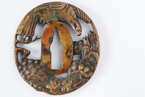 This is the hand guard (Tsuba) of the Japanese sword.