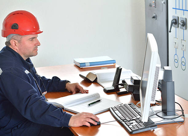 istock Engineer Works at Desk in Power Plant 522329634