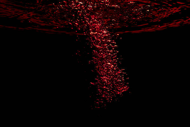 Swirling colorful air bubble jet in black water