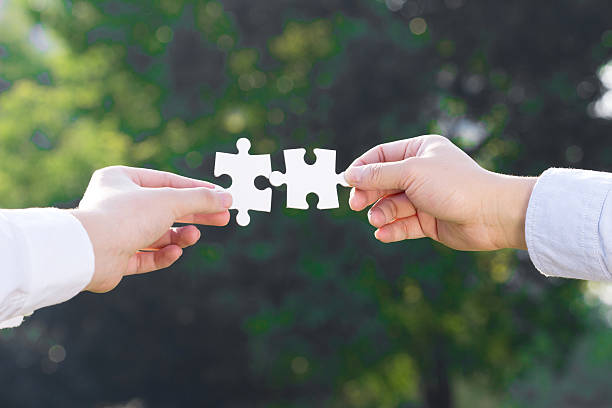 istock puzzle jigsaw and concept with trees background 522330417