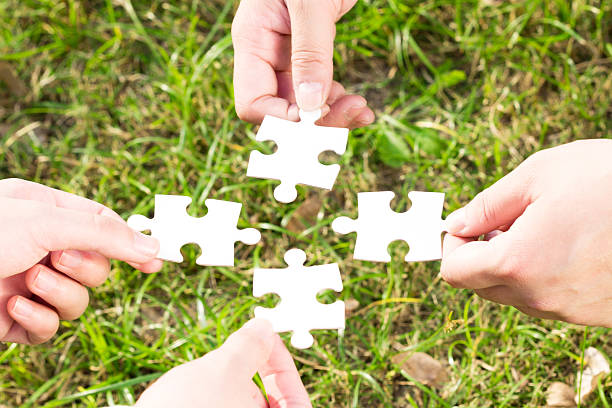 istock puzzle jigsaw and concept with meadow background 522330477