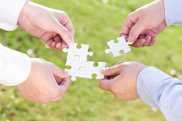 istock puzzle jigsaw and concept with meadow background 522330741