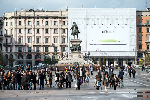 Square Duomo located in the center of Milan. Spectacular image of the monument to King Vittor Emmanuel II and of the cathedral of Milan in back light in the early morning