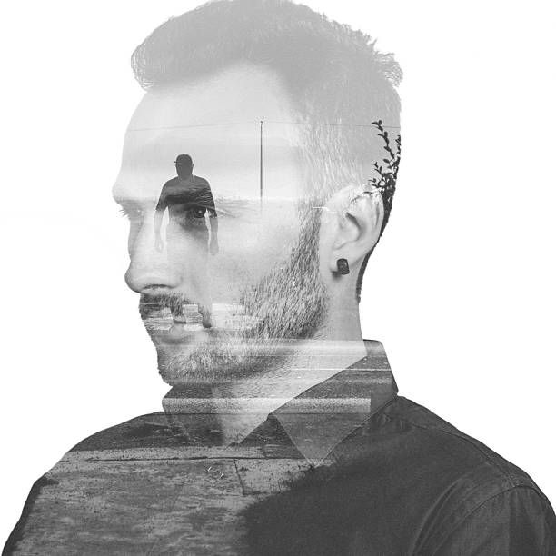 istock Black and white double exposure potrait of a man 522331362