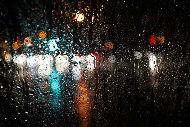 istock Blurred rain background, view through wet car window 522331500