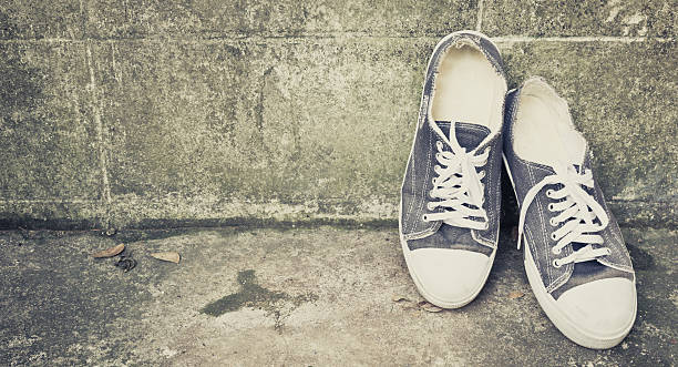 istock blue vintage shoes lean on old aged wall 522331633