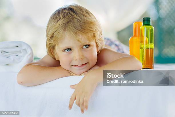 Little Kid Boy Relaxing In Spa With Enjoying Massage Stock Photo - Download Image Now