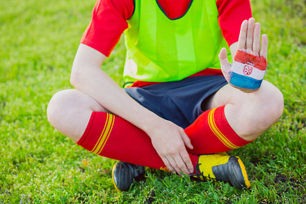 istock Man showing painted  Croatia flag, hands 522333226