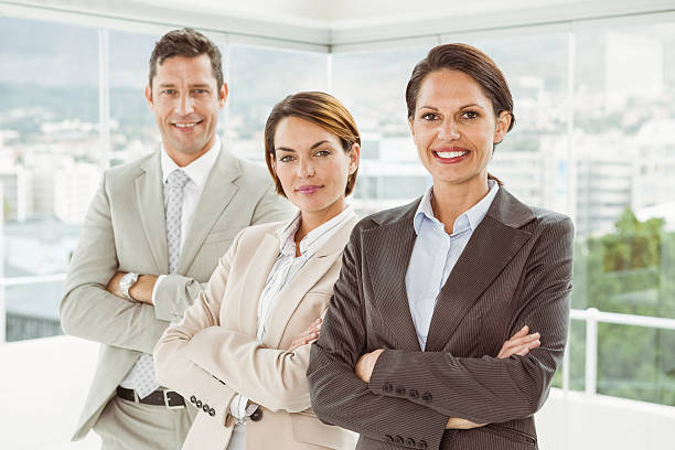 istock Confident business people with arms crossed in office 522334165