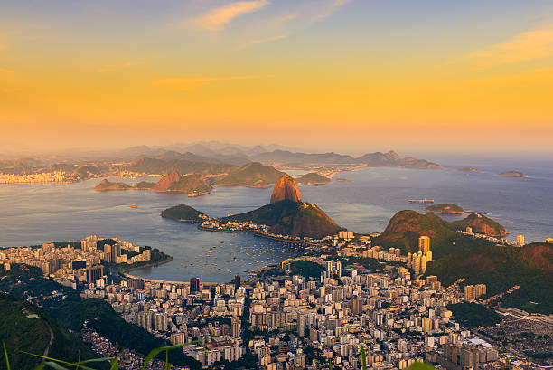 Mountain Sugar Loaf and Botafogo in Rio de Janeiro. Brazil Sunset view of mountain Sugar Loaf and Botafogo. Rio de Janeiro copacabana rio de janeiro stock pictures, royalty-free photos & images