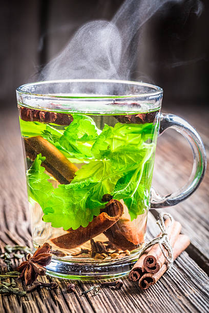 istock Warm tea with green leaves 522334553