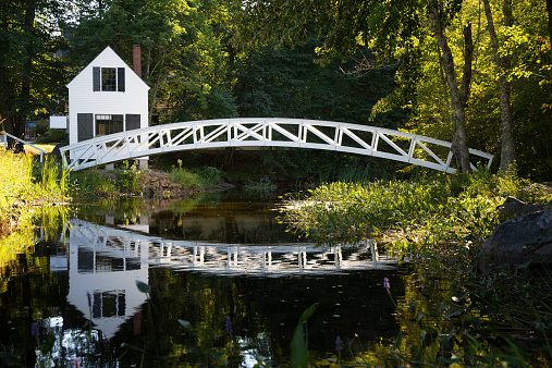 White wooden bridge reflected in a pond, Somesville, Mount Desert Island, Maine, USA
