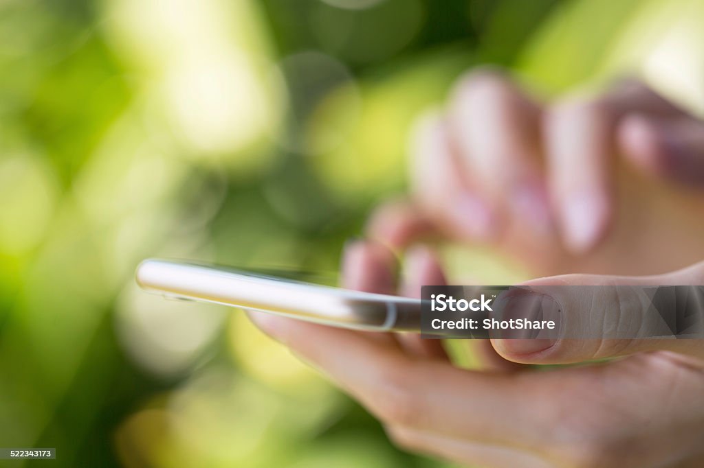 Woman holding phone Activity Stock Photo