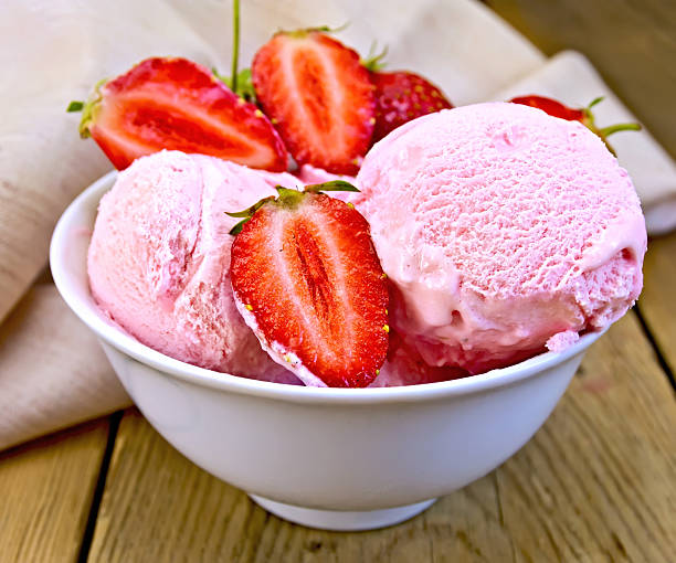 istock Ice cream strawberry in bowl on board with cloth 522345635