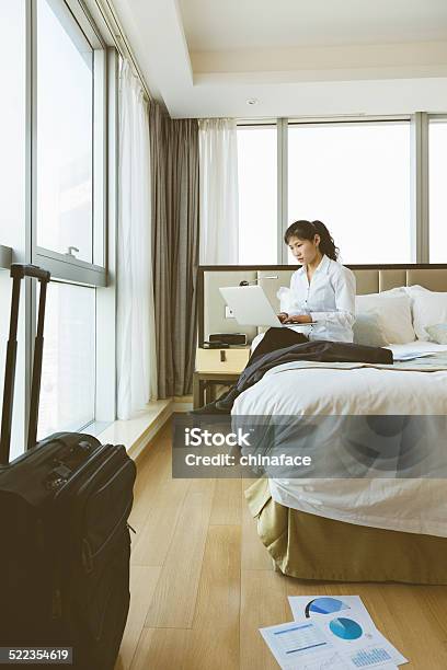 Businesswoman Working On Her Laptop In The Bed Stock Photo - Download Image Now - 20-24 Years, Adult, Adults Only