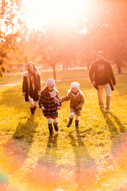 istock Playful family in autumn. 522354647
