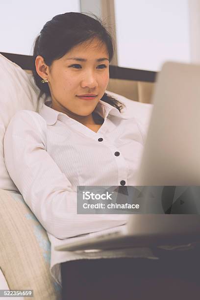 Businesswoman Working On Her Laptop In The Bed Stock Photo - Download Image Now - 20-24 Years, Adult, Adults Only