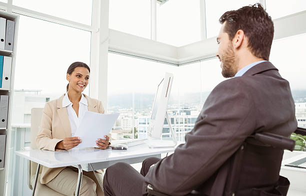 istock Businesswoman interviewing man in office 522356655