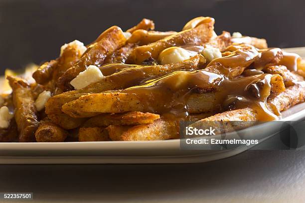 Canadian Poutine Gravy And French Fries Stock Photo - Download Image Now - Brown, Canada, Canadian Culture