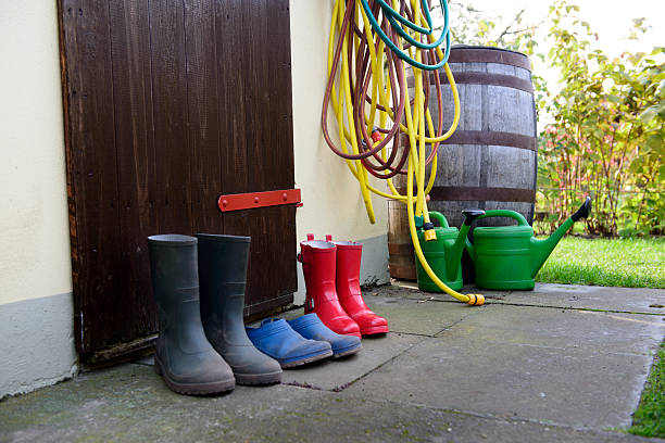 rubber boots Various rubber boots for gardening garden hose photos stock pictures, royalty-free photos & images