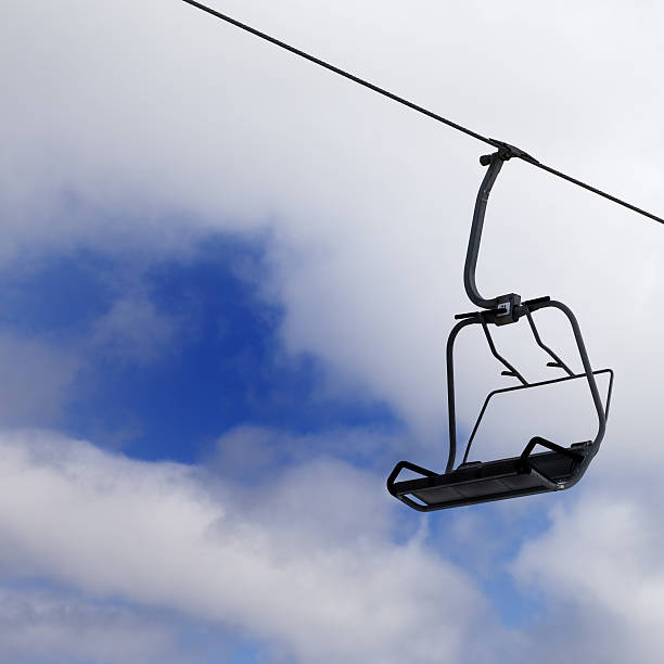 istock Chair-lift and cloudy sky 522360809