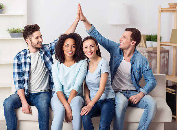istock Positive friends resting on the couch 522367694