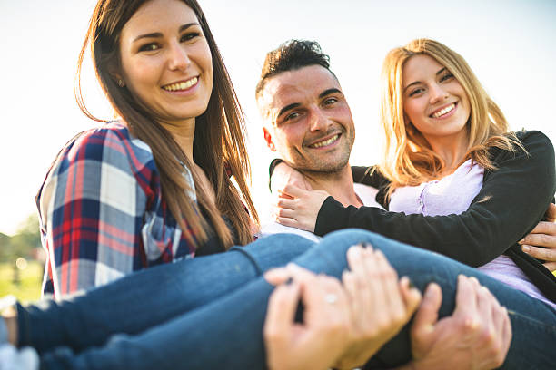 Group of college student laughing at the park